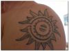 tribal sun shoulder tattoo